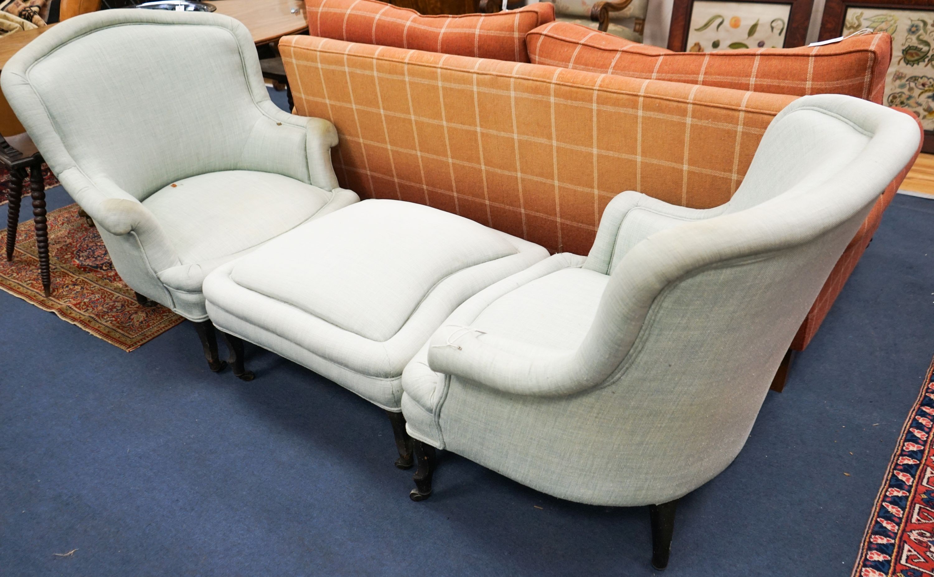 A French Duchesse Brisee comprising a pair of tub armchair and matching stool, on carved beech cabriole legs, chairs width 82cm